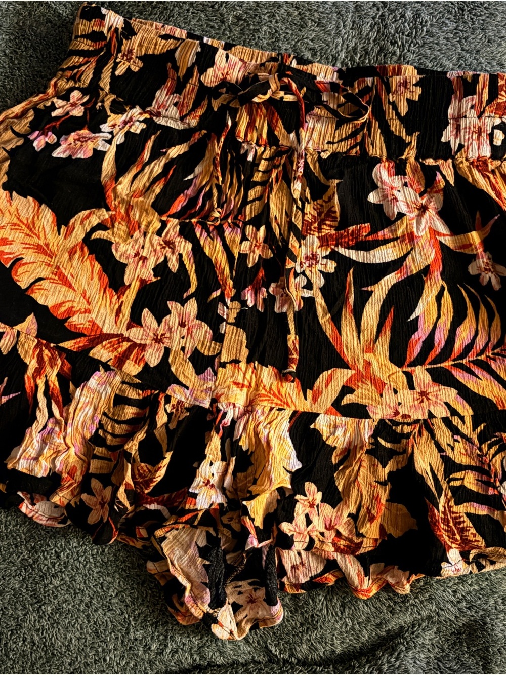 Rip Curl Black Floral Print Ruffle Skirt with Warm Tones